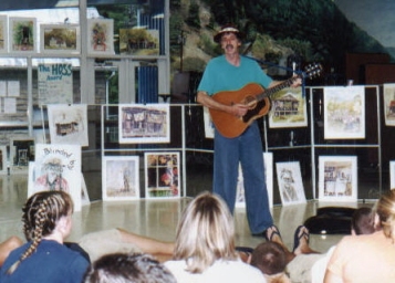 Whitaker playing guitar